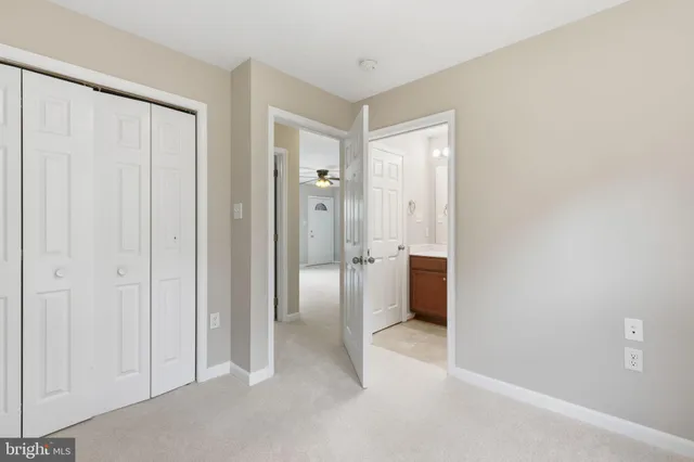 a view of a hallway with an entryway door