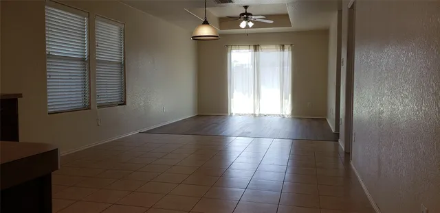 a view of a hallway with a chandelier