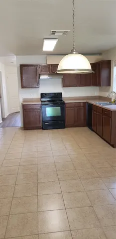 a kitchen with stainless steel appliances a sink and a stove