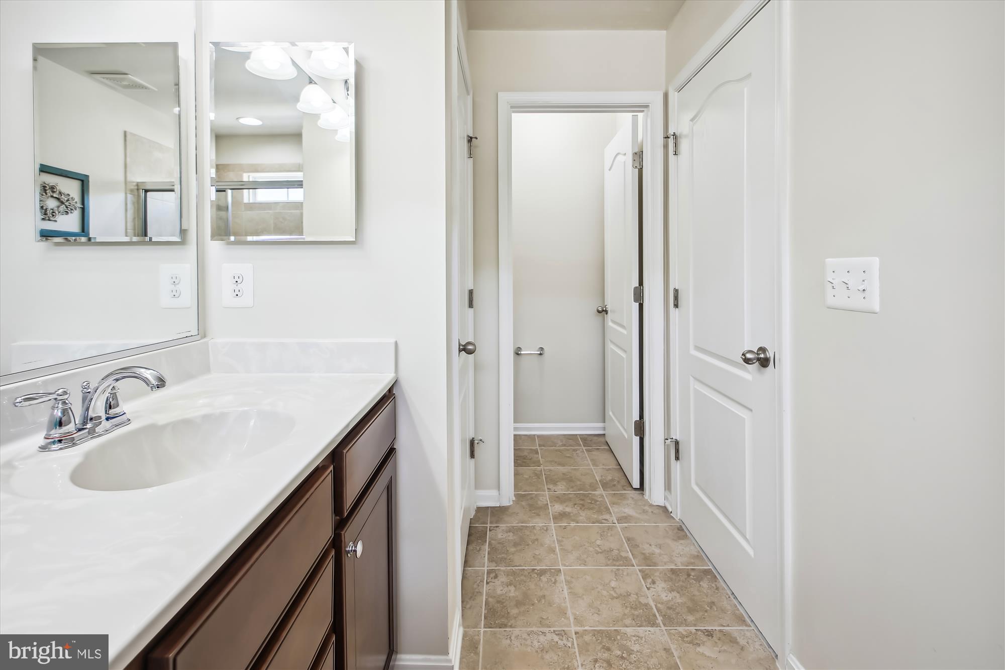 7941 Silver Oak Road Hanover, MD 21076 - Photo 24 of 56 DUAL SINK STORAGE VANITY & TILE FLOORING