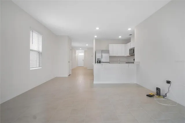 a view of a kitchen and windows