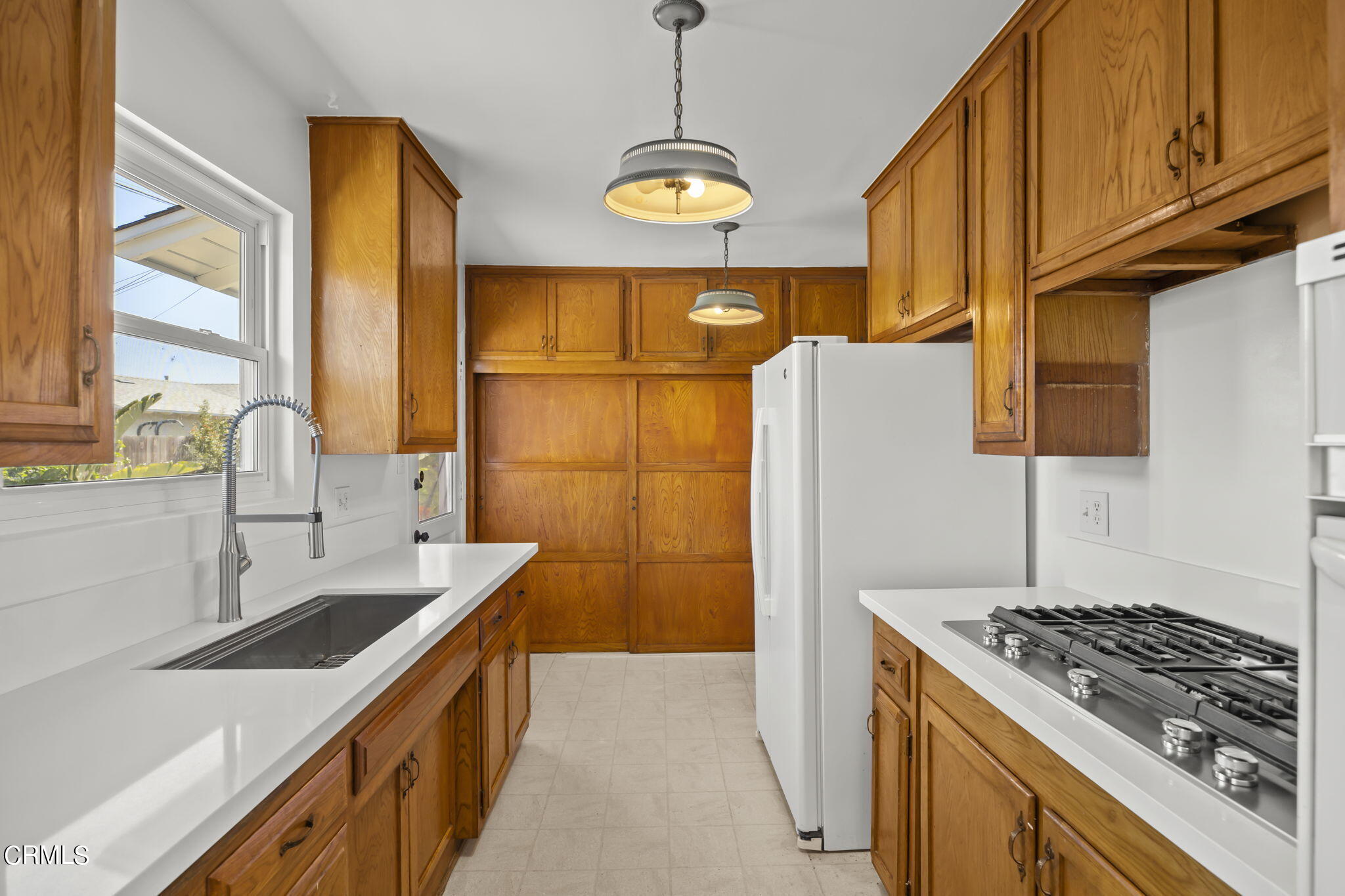 237 Brucker Road West Oxnard, CA 93033 - Photo 16 of 29 a kitchen with stainless steel appliances granite countertop a sink stove and refrigerator
