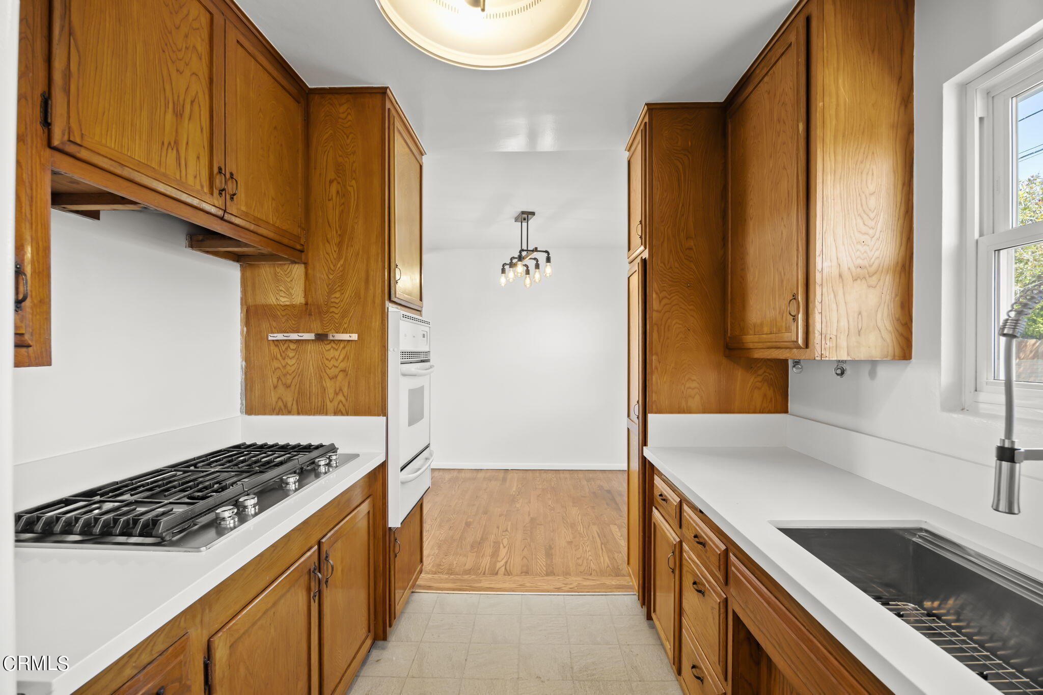 237 Brucker Road West Oxnard, CA 93033 - Photo 17 of 29 a kitchen with a sink stove and cabinets