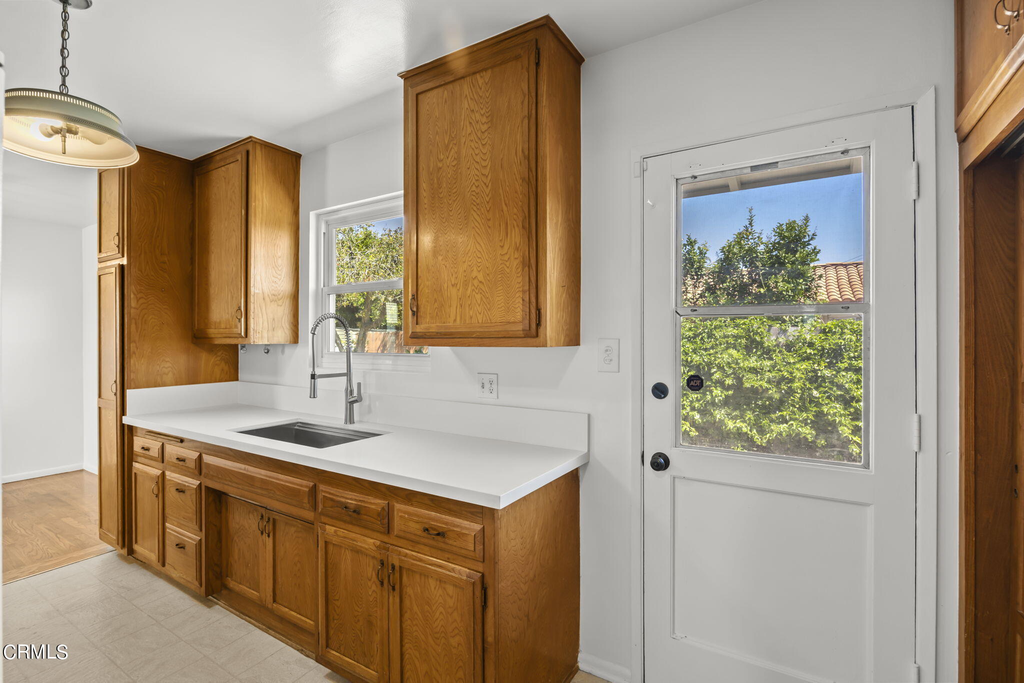 237 Brucker Road West Oxnard, CA 93033 - Photo 18 of 29 a bathroom with a granite countertop sink and a window