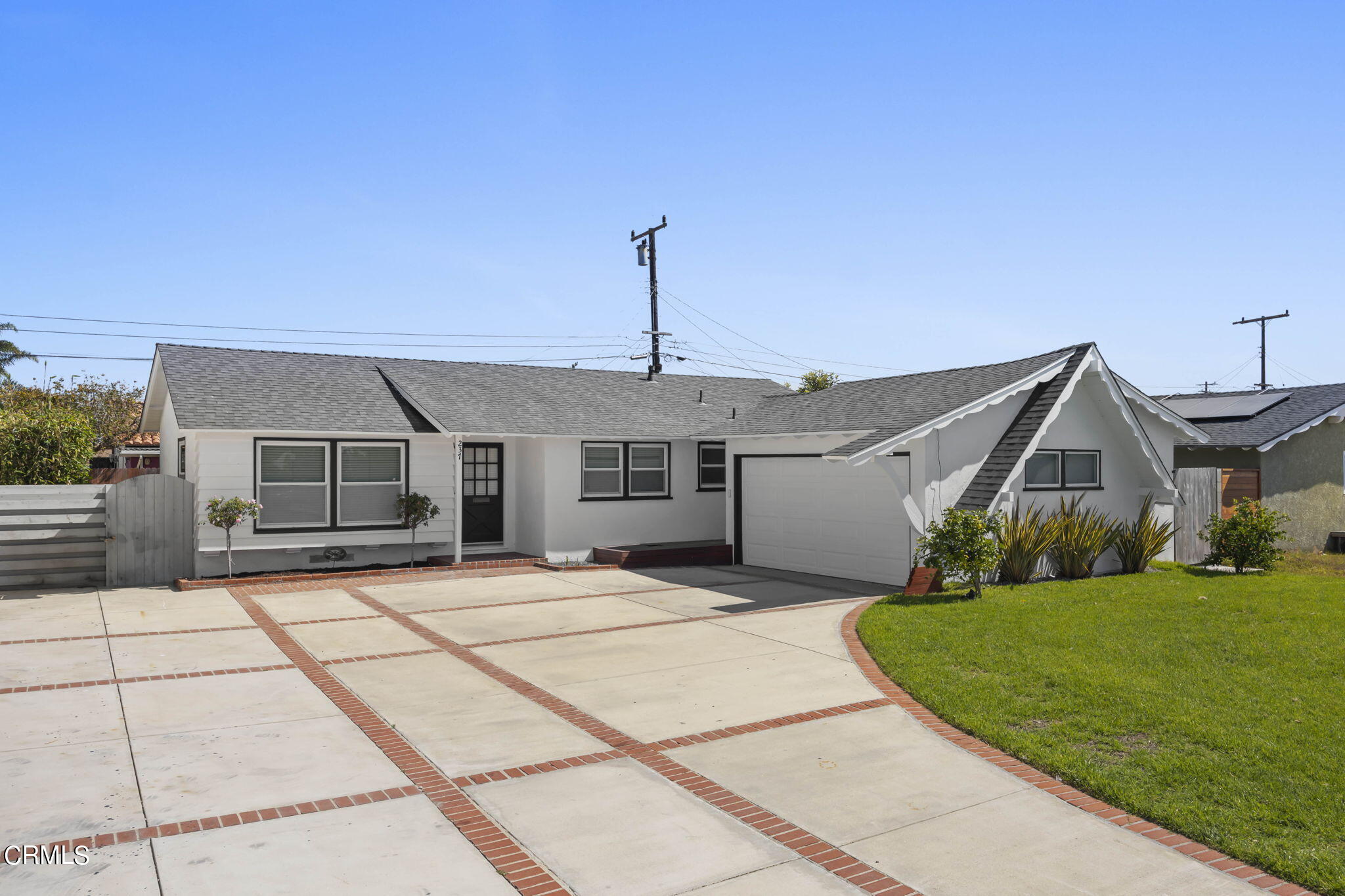 237 Brucker Road West Oxnard, CA 93033 - Photo 2 of 29 a front view of a house with a garden