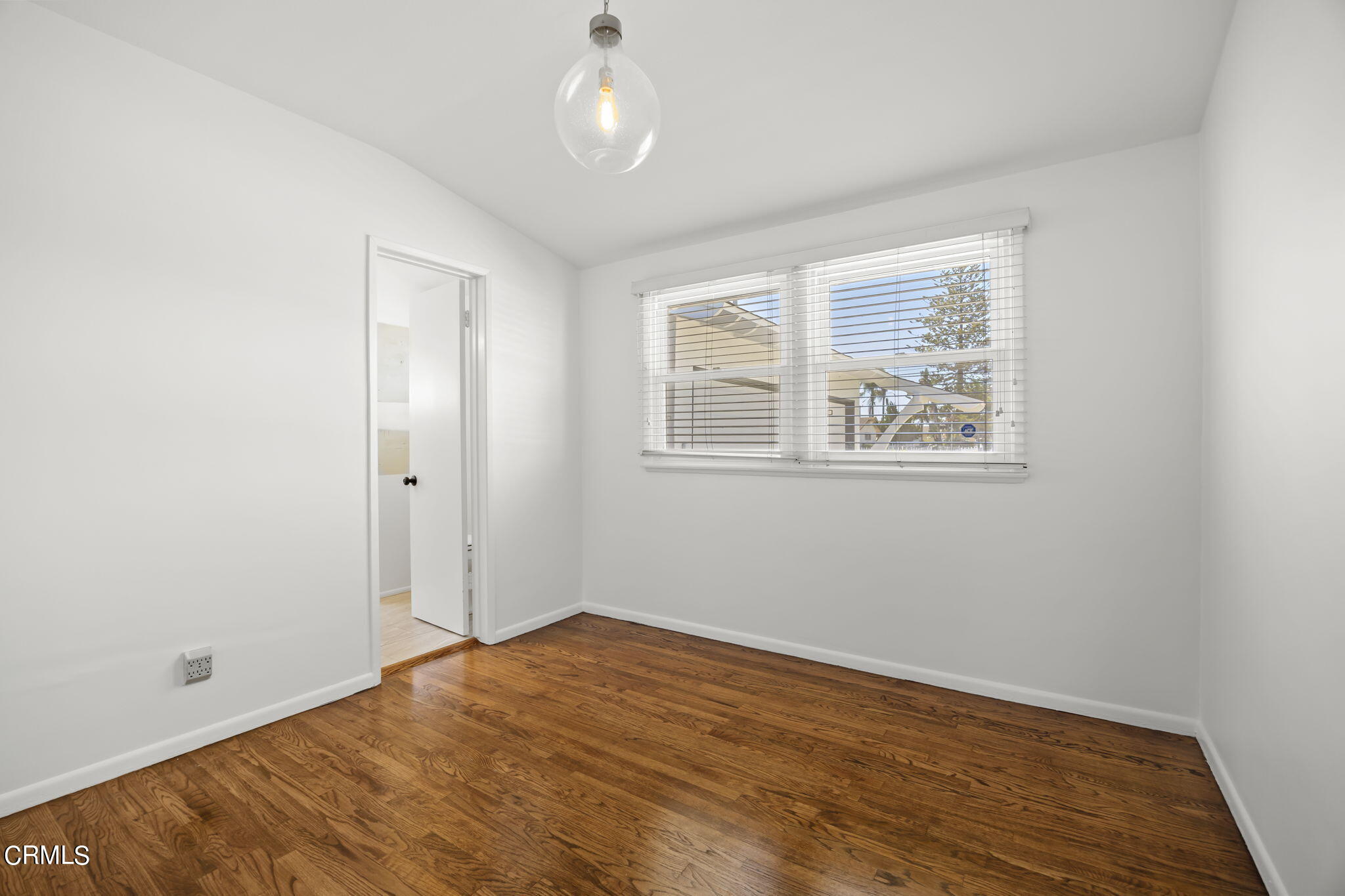 237 Brucker Road West Oxnard, CA 93033 - Photo 24 of 29 wooden floor in an empty room with a window