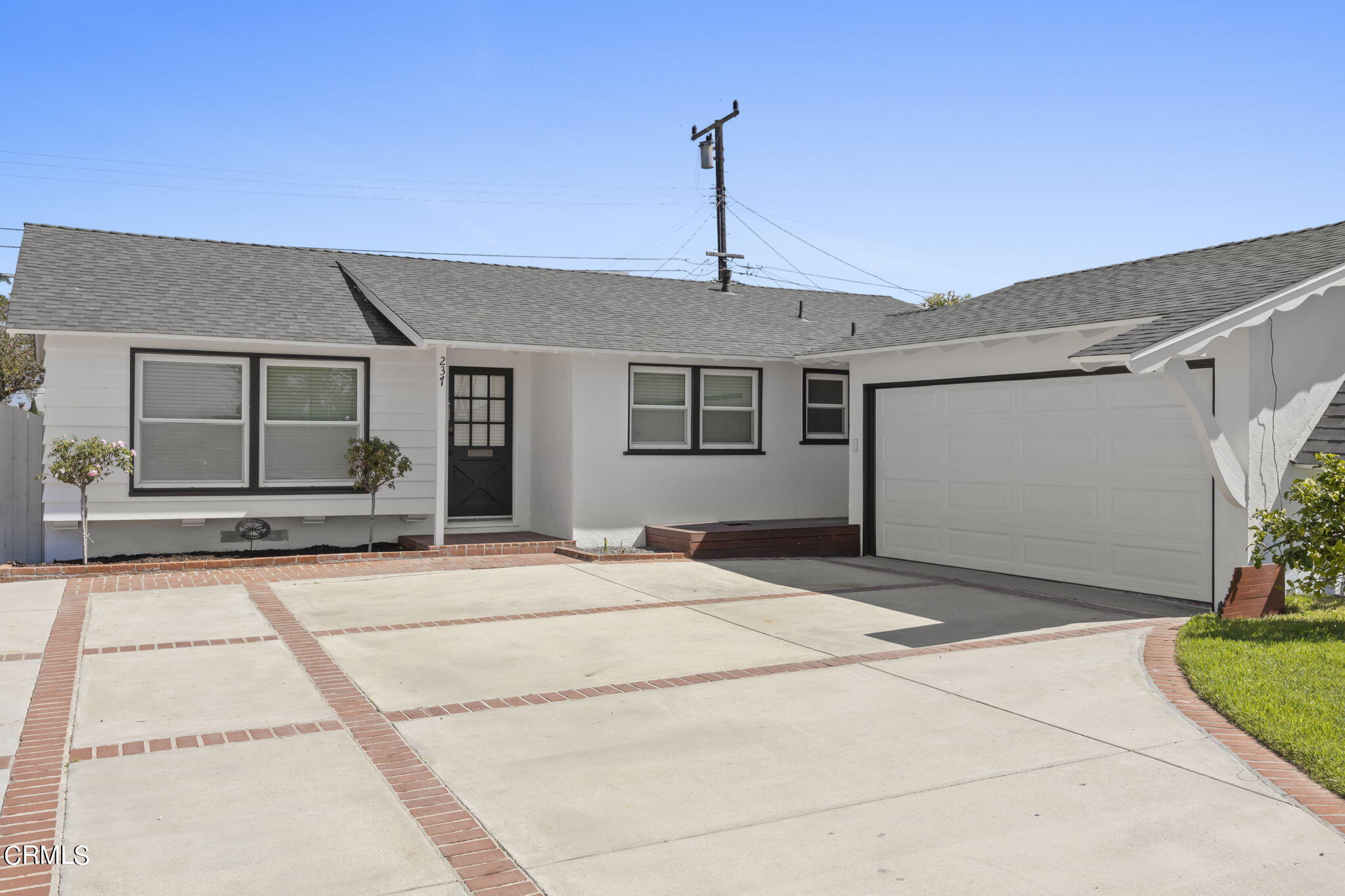 237 Brucker Road West Oxnard, CA 93033 - Photo 5 of 29 a front view of a house with a garden