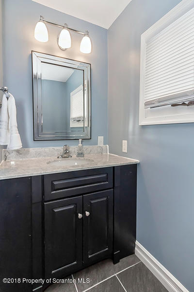 361 Upper Demunds Road Dallas, PA 18612 - Photo 18 of 27 a bathroom with a sink vanity and mirror