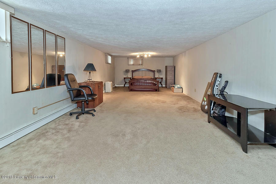 361 Upper Demunds Road Dallas, PA 18612 - Photo 22 of 27 a view of a livingroom with furniture and a window