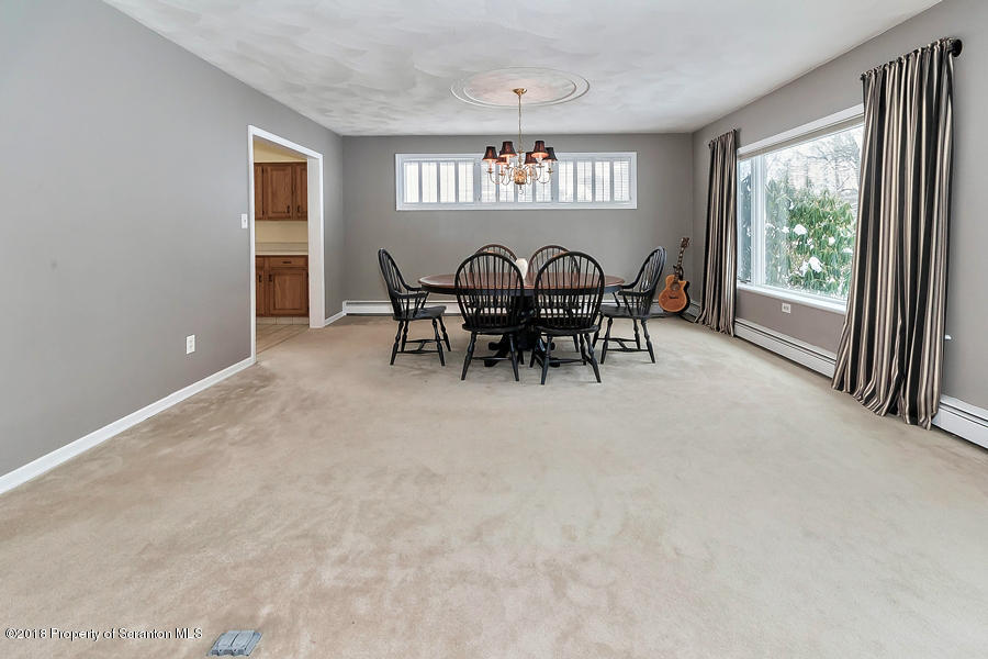 361 Upper Demunds Road Dallas, PA 18612 - Photo 4 of 27 a view of a dining room with furniture window and outside view
