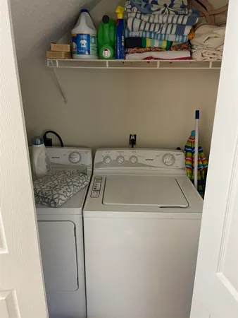 a utility room with dryer and washer