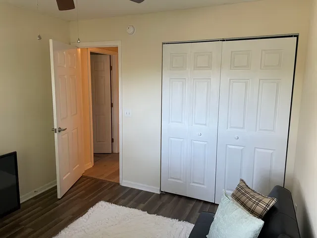 a view of an empty room and wooden floor