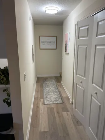 wooden floor with closet in a bathroom