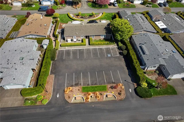an aerial view of residential houses with outdoor space