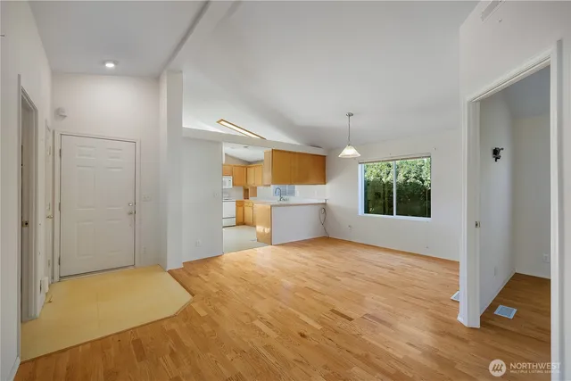 a view of a kitchen with a sink cabinet and a window