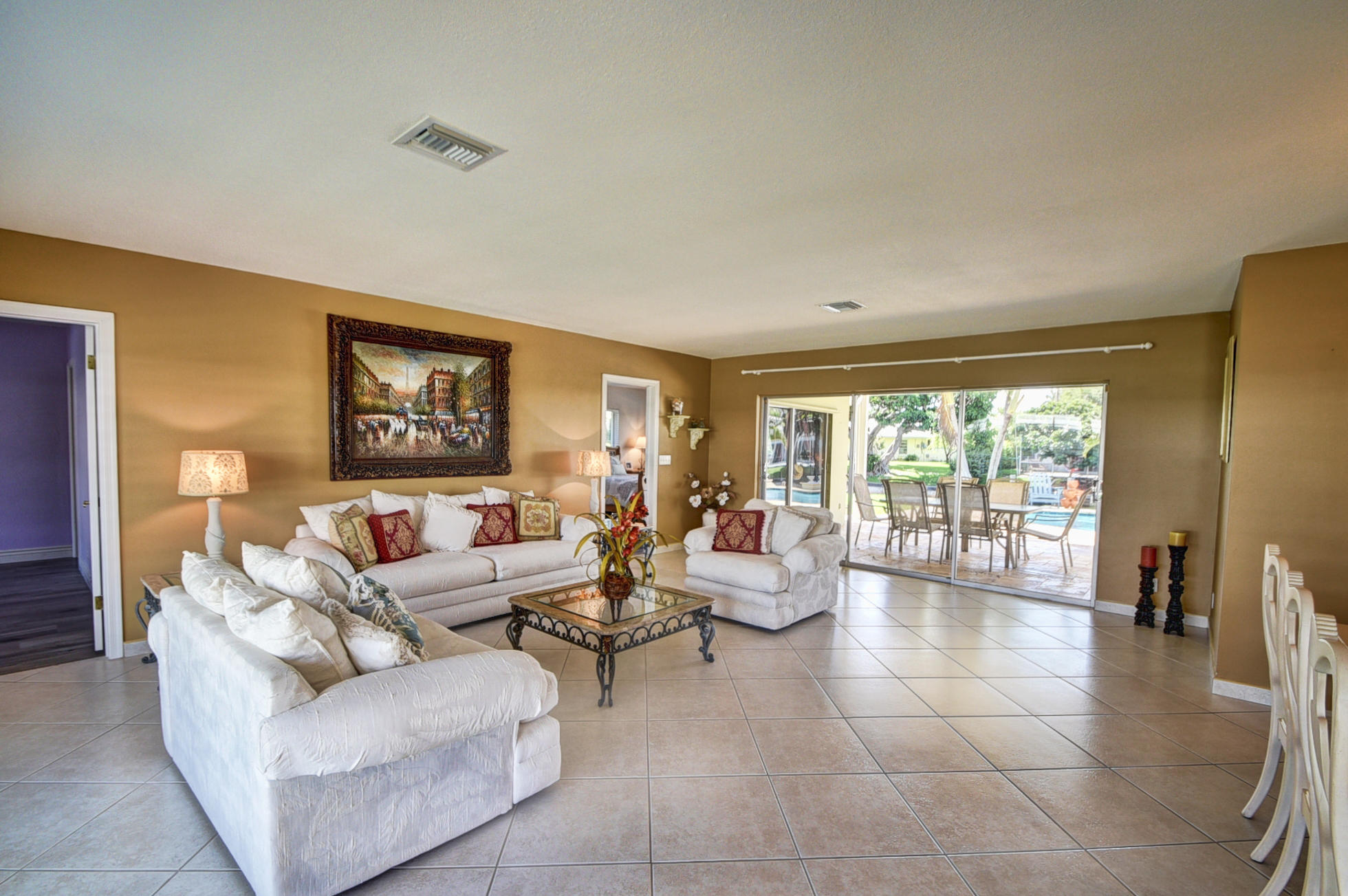 736 Apple Tree Lane Boca Raton, FL 33486 - Photo 4 of 43 a living room with furniture and a gate
