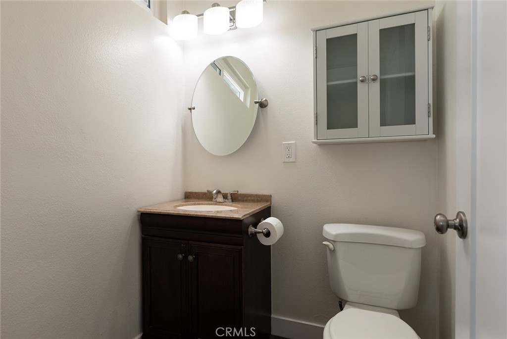 41134 Vía Halcon Temecula, CA 92591 - Photo 11 of 28 a bathroom with a toilet a sink and mirror