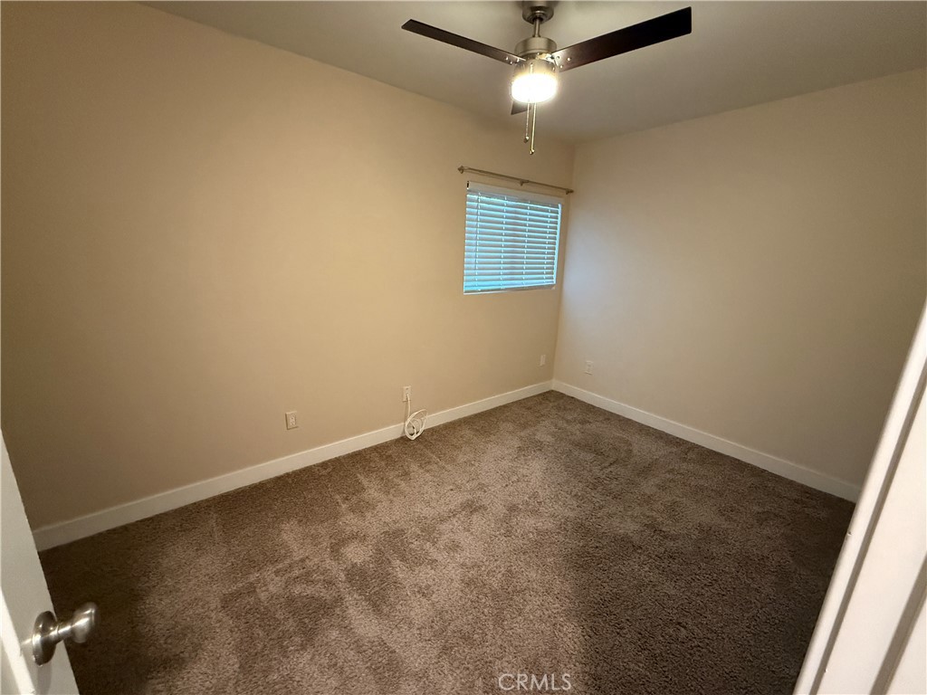 41134 Vía Halcon Temecula, CA 92591 - Photo 24 of 28 an empty room with a ceiling fan and a window