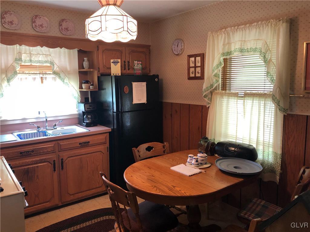 3733 Huckleberry Road Allentown, PA 18104 - Photo 3 of 15 a view of a dining room with furniture large window and wooden floor