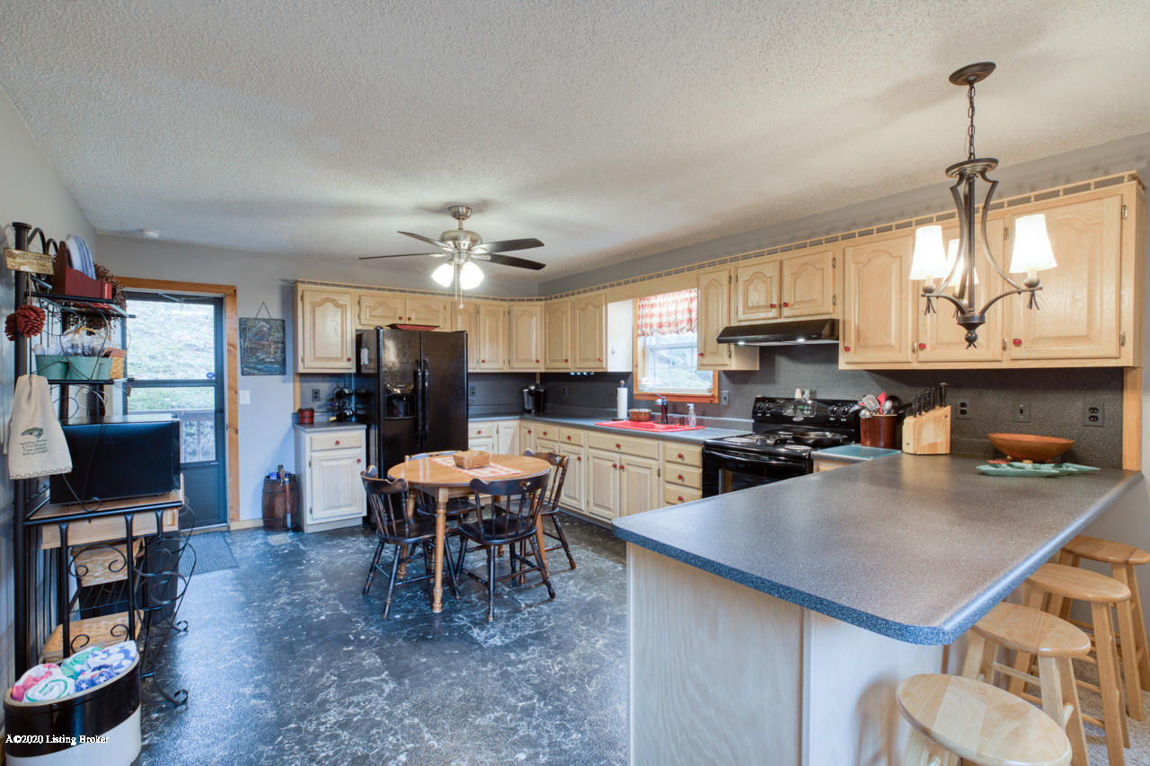 436 Out Post Road Leitchfield, KY 42754 - Photo 12 of 46 Large eat in kitchen with serving bar for hosting large groups
