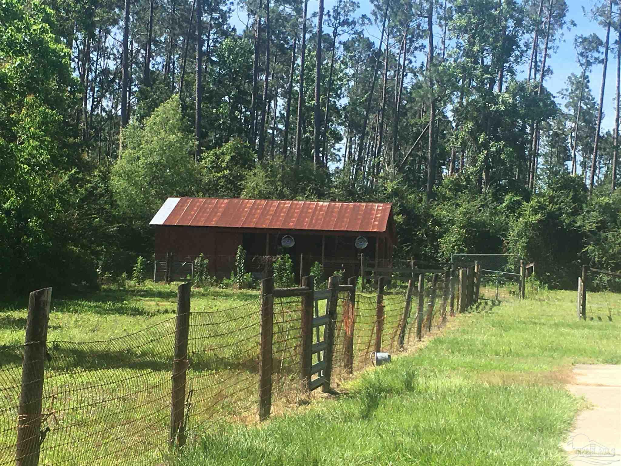 1381 Ridge Way Cantonment, FL 32533 - Photo 22 of 41 FENCING AROUND BARN AND STALLS