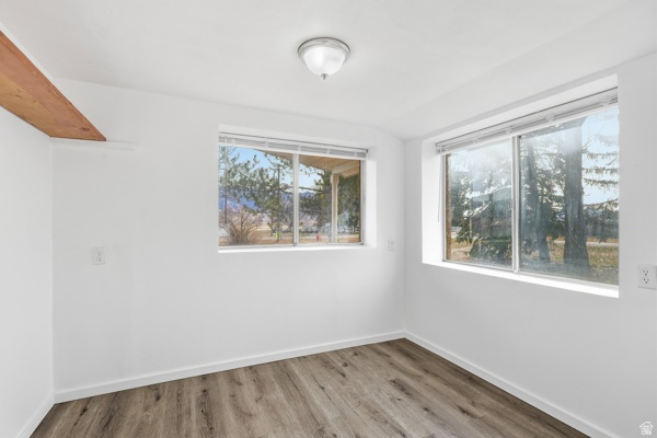 25615 Main Street Portage, UT 84331 - Photo 14 of 42 Spare room featuring light wood-type flooring and baseboards