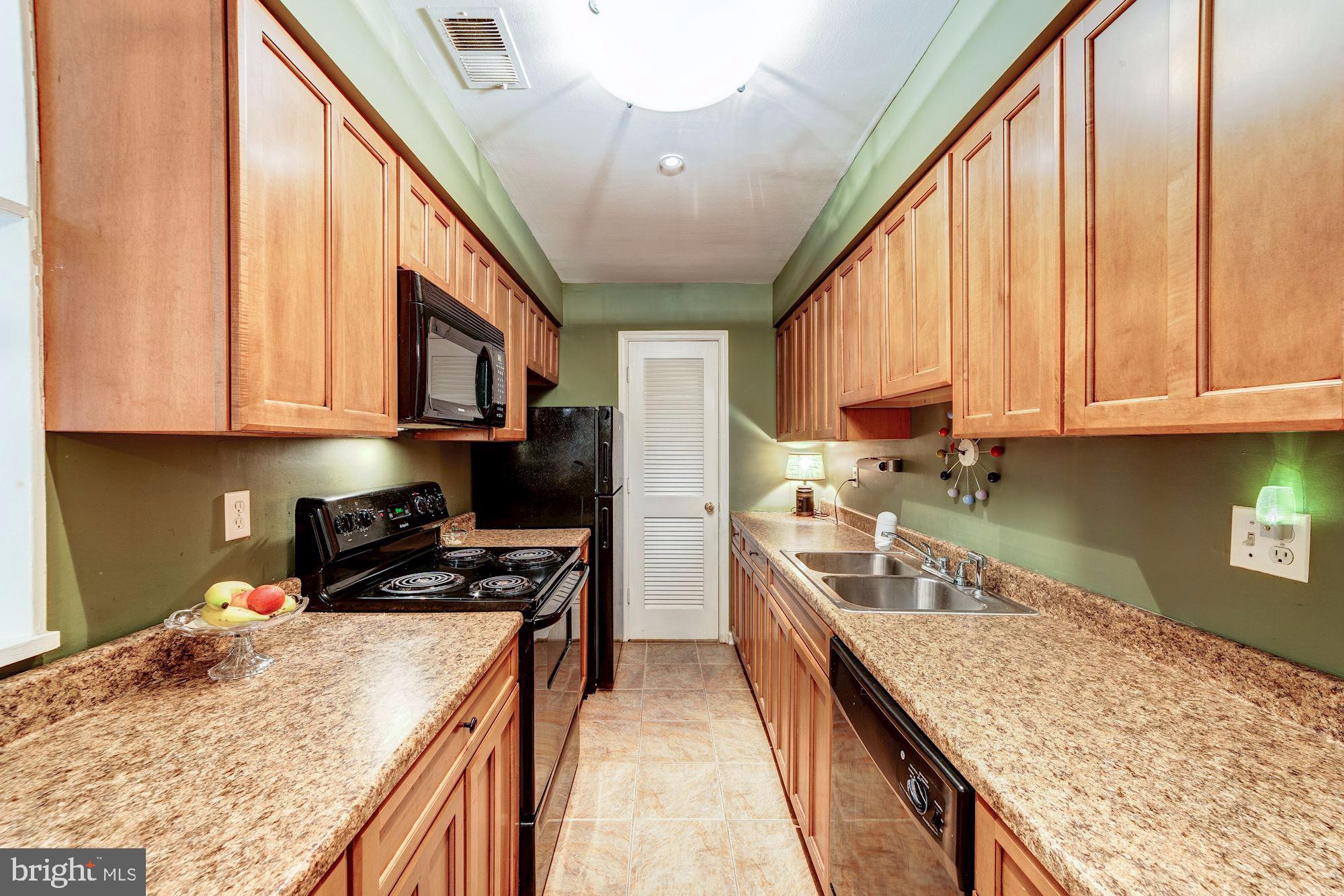 5905 Noblestown Road, Unit I Springfield, VA 22152 - Photo 7 of 29 Replaced maple cabinetry with large walk-in pantry