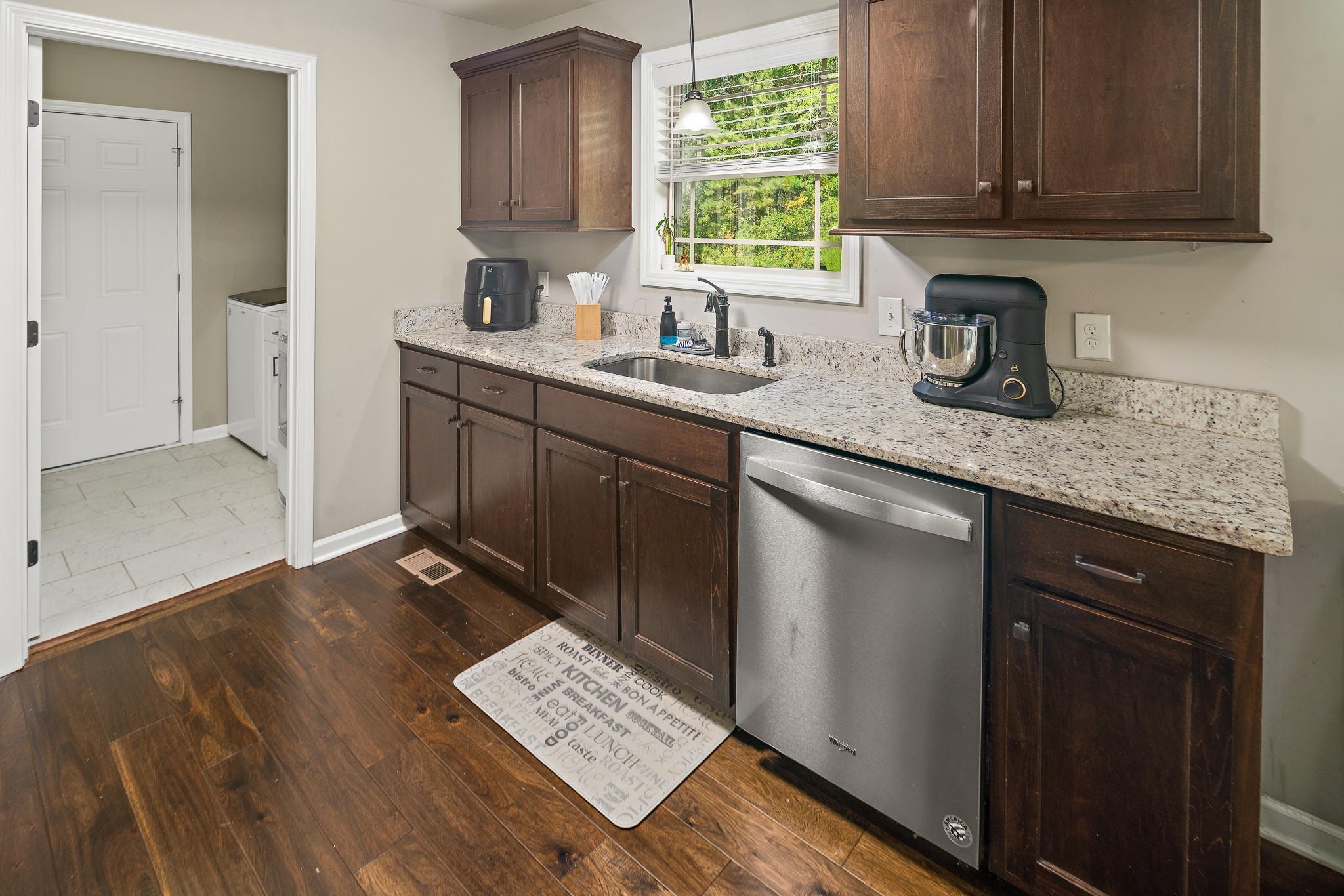 1550 South Spring Street Manchester, TN 37355 - Photo 11 of 26 a kitchen with sink cabinets and window
