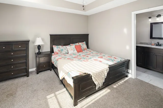 a bedroom with a bed and a television