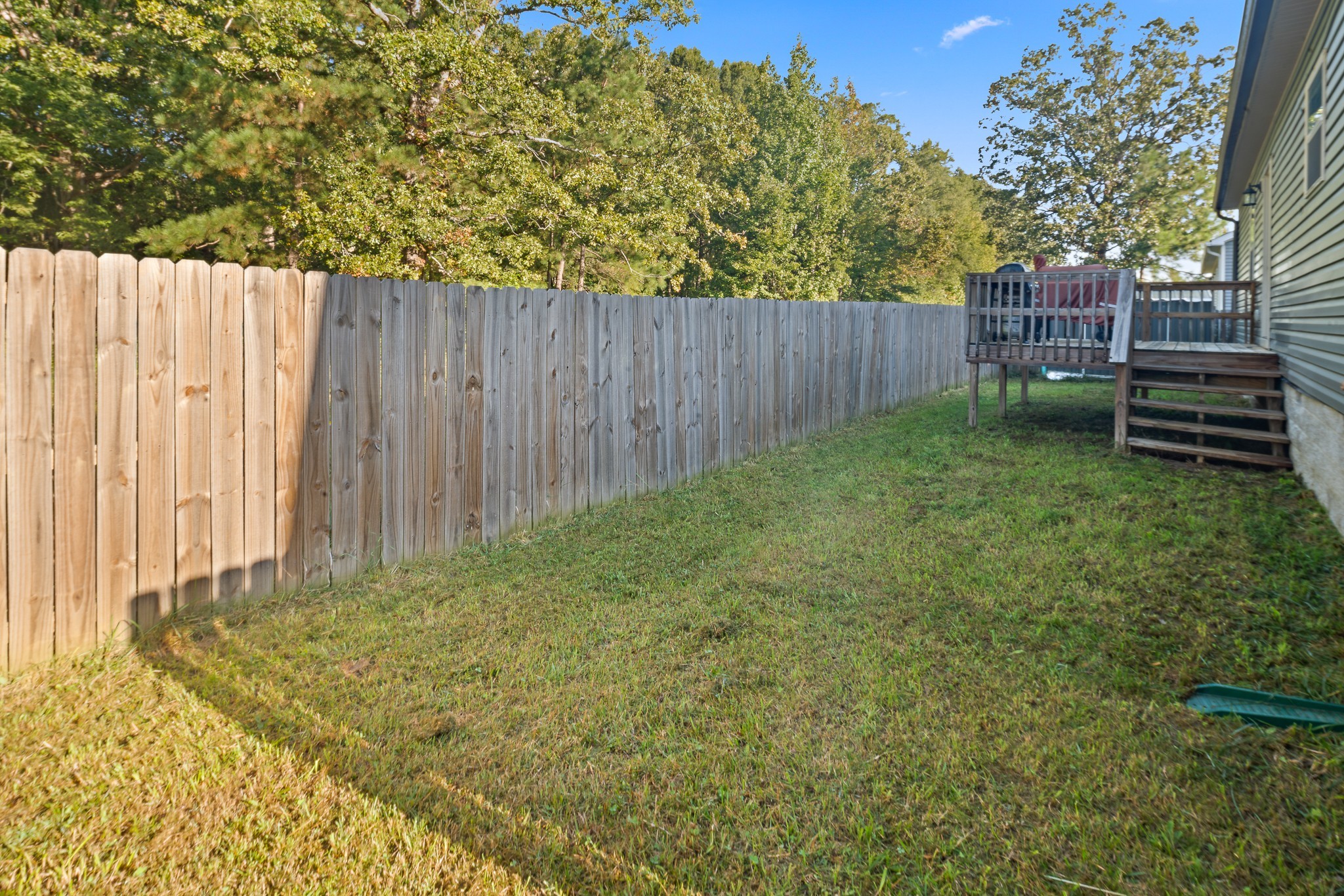 1550 South Spring Street Manchester, TN 37355 - Photo 23 of 26 a view of backyard with wooden fence and a large tree