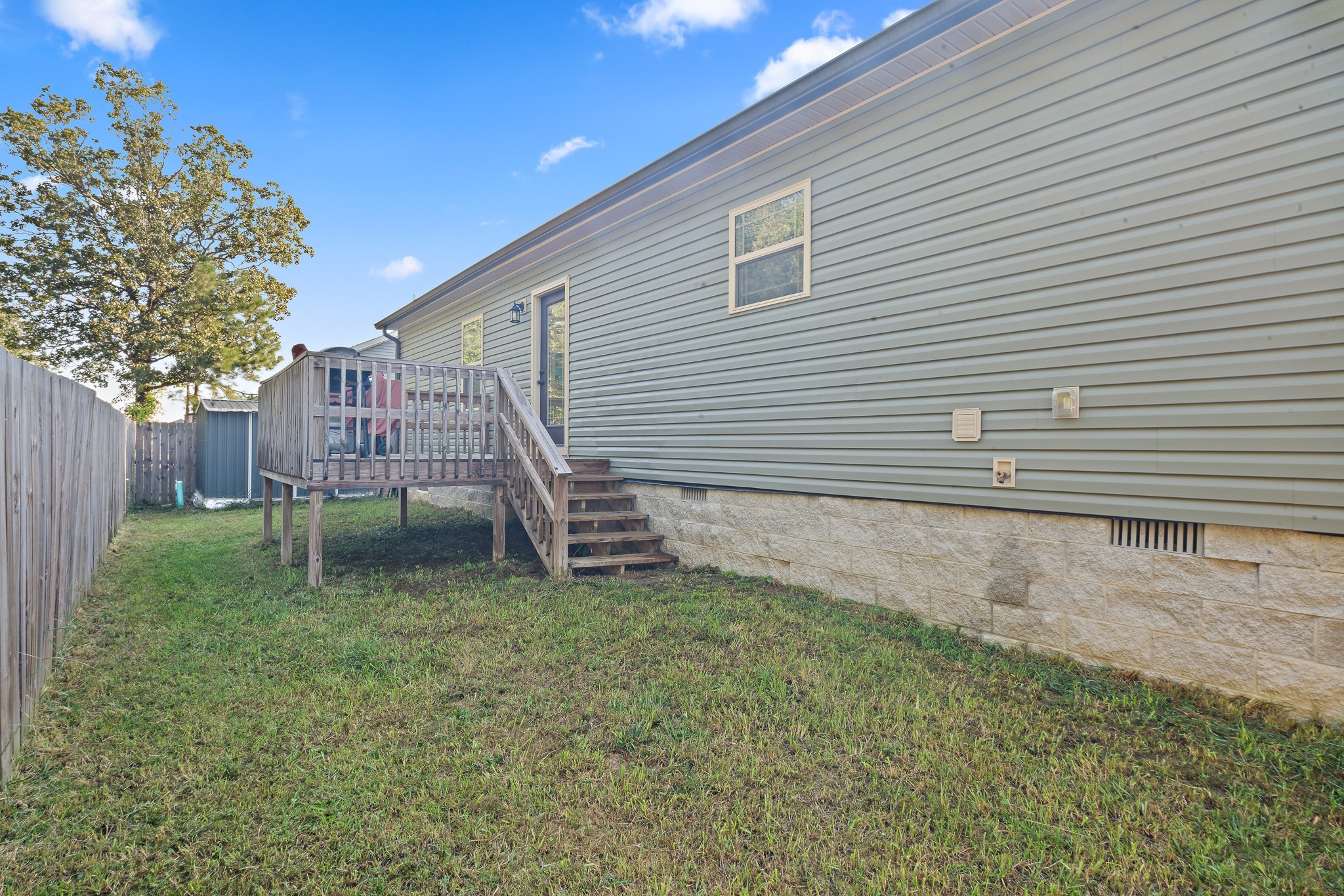 1550 South Spring Street Manchester, TN 37355 - Photo 24 of 26 a view of a house with a yard and deck