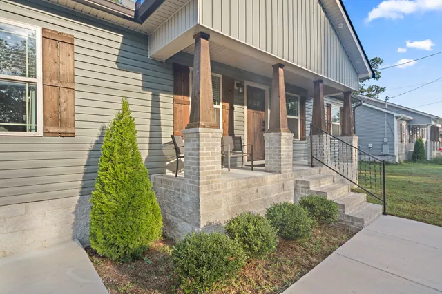 a view of house with backyard