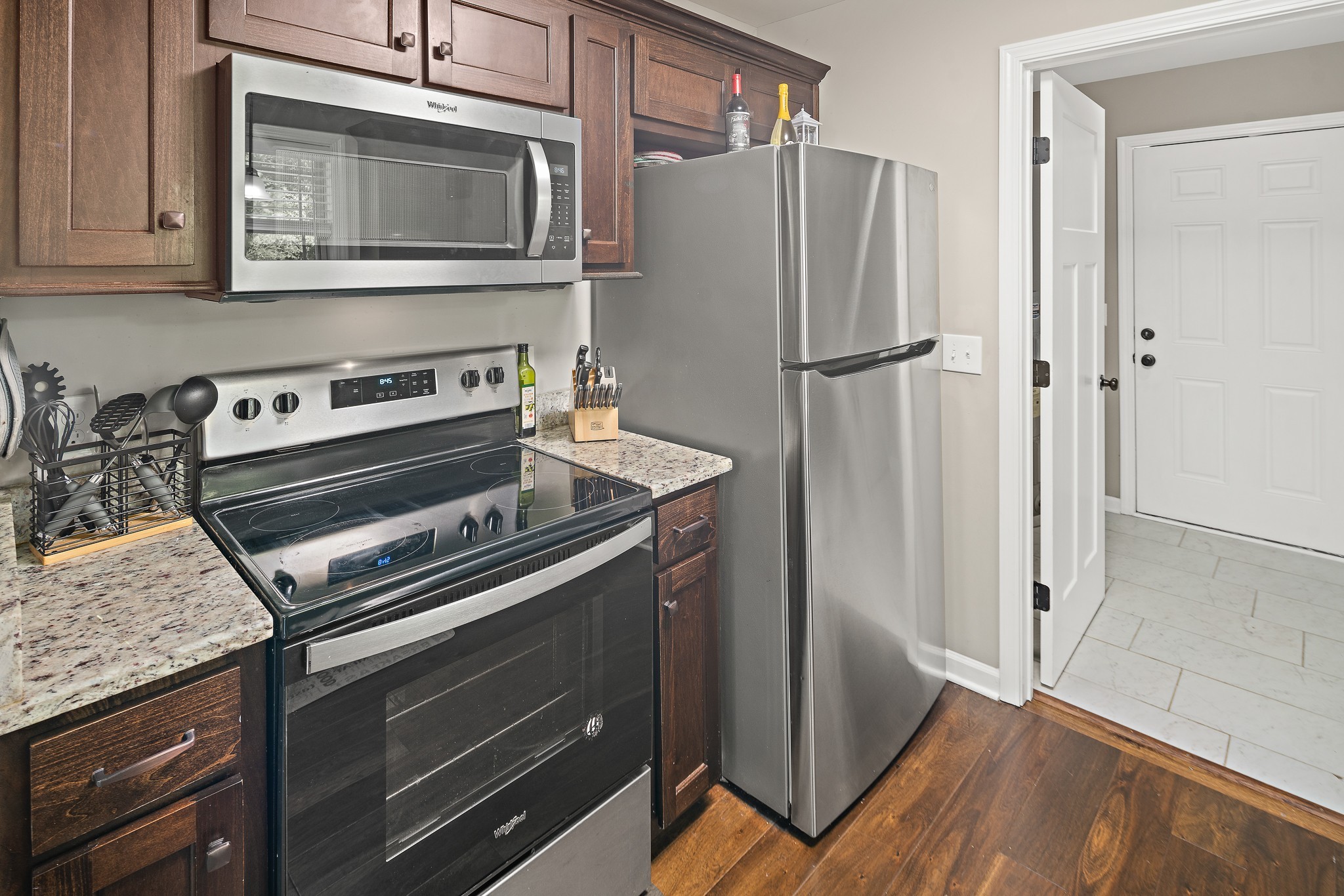 1550 South Spring Street Manchester, TN 37355 - Photo 9 of 26 a kitchen with wooden cabinets and a stove top oven