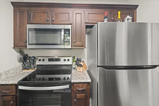 a kitchen with appliances and cabinets