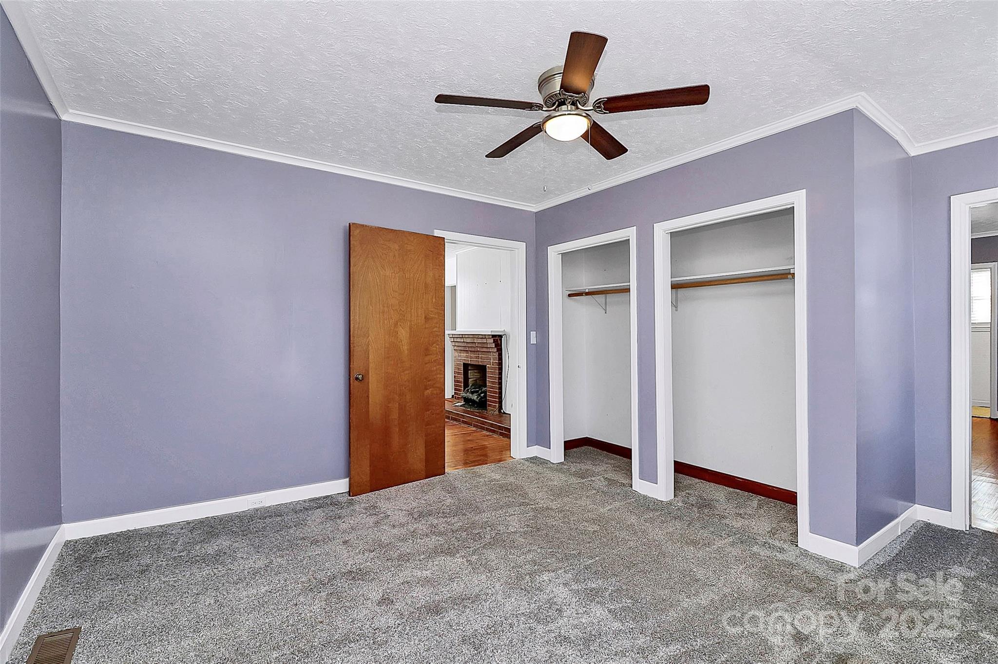 511 West Elliott Street Chester, SC 29706 - Photo 12 of 32 a view of a livingroom with a ceiling fan and wooden floor