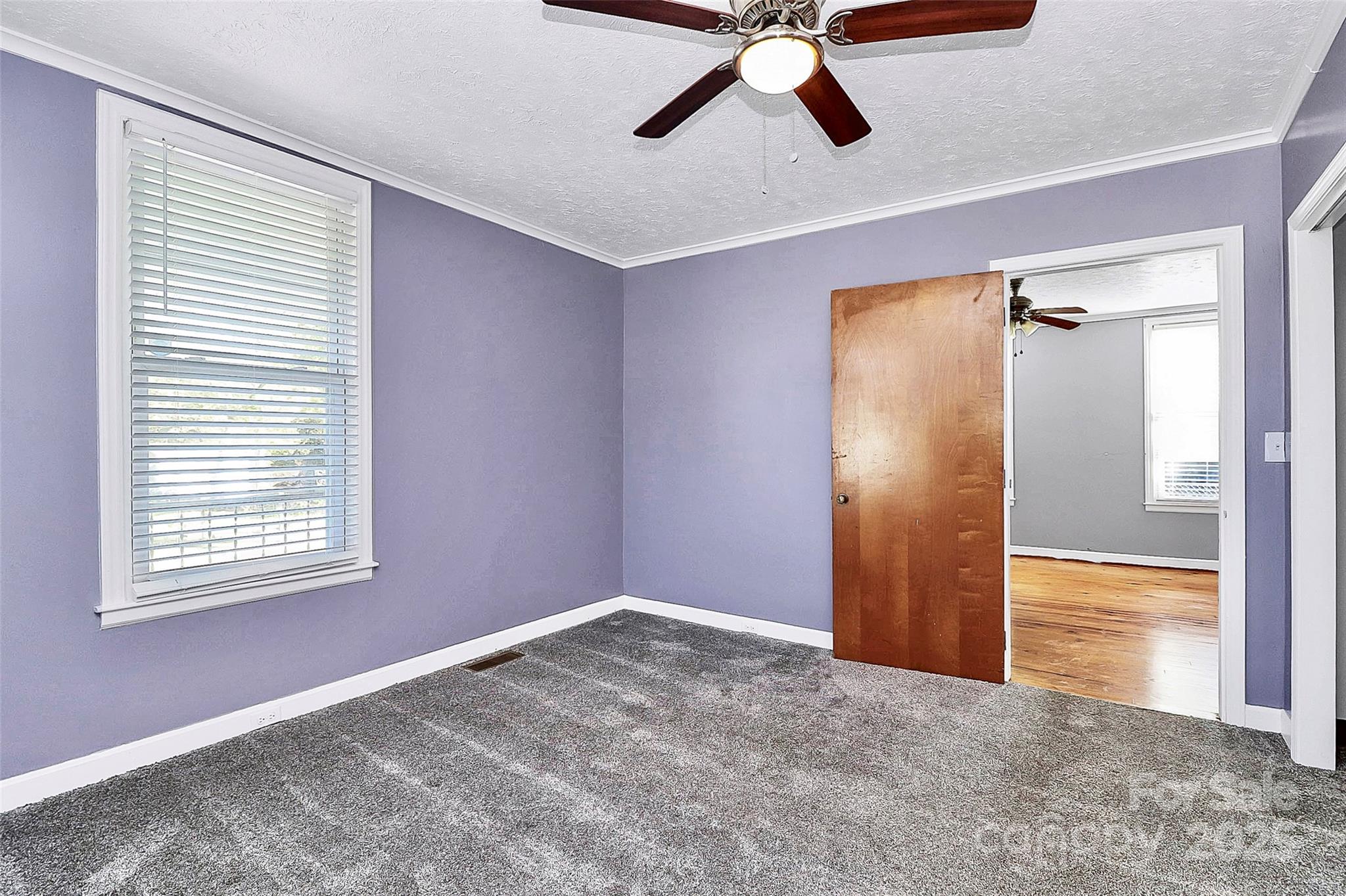 511 West Elliott Street Chester, SC 29706 - Photo 14 of 32 an empty room with closet and windows