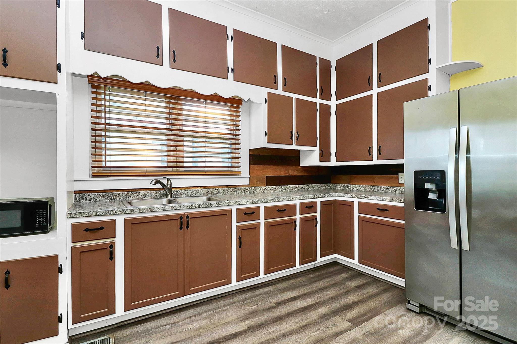 511 West Elliott Street Chester, SC 29706 - Photo 19 of 32 a kitchen with stainless steel appliances granite countertop a stove and a refrigerator