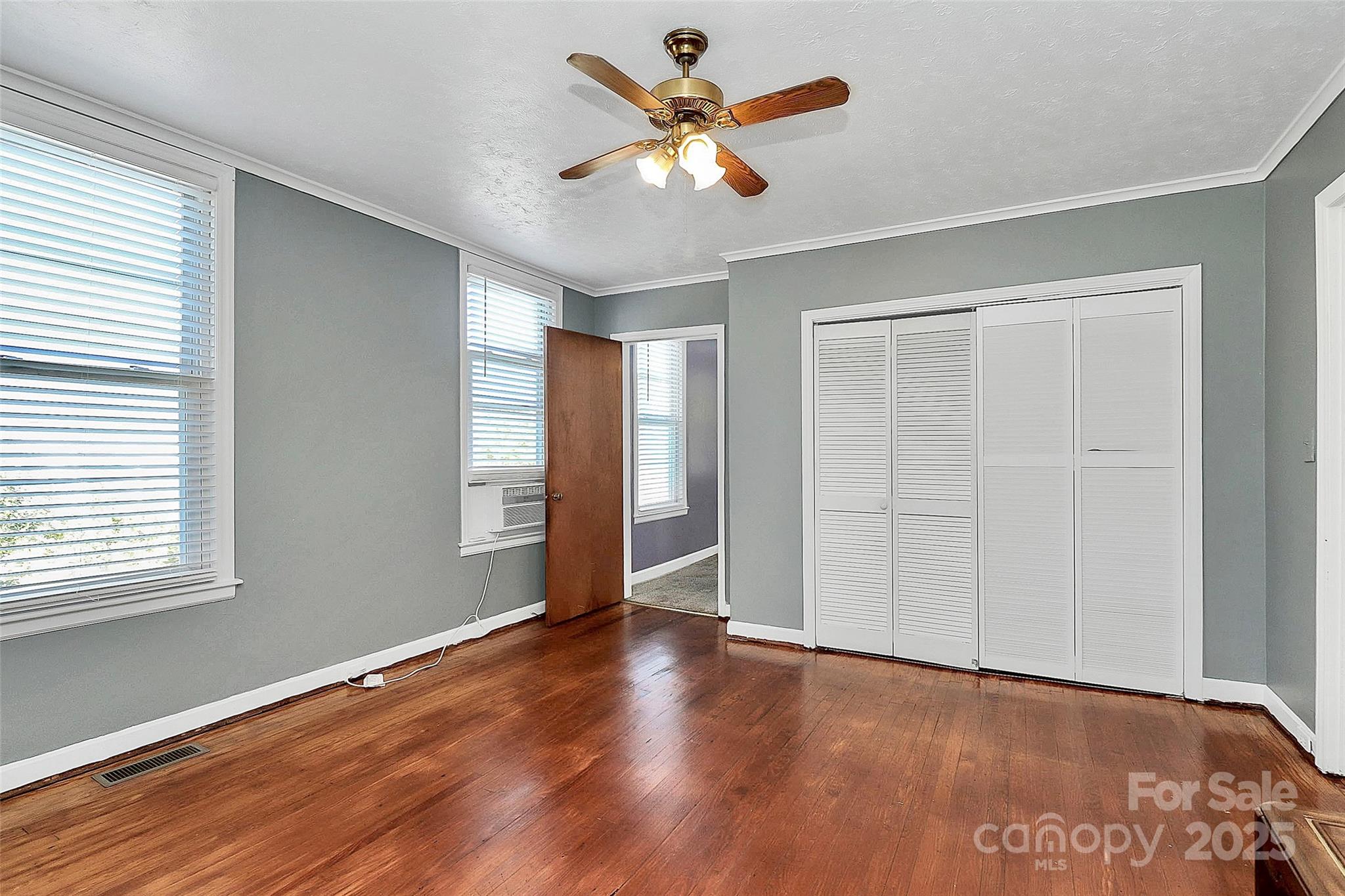 511 West Elliott Street Chester, SC 29706 - Photo 24 of 32 a view of an empty room with window and wooden floor
