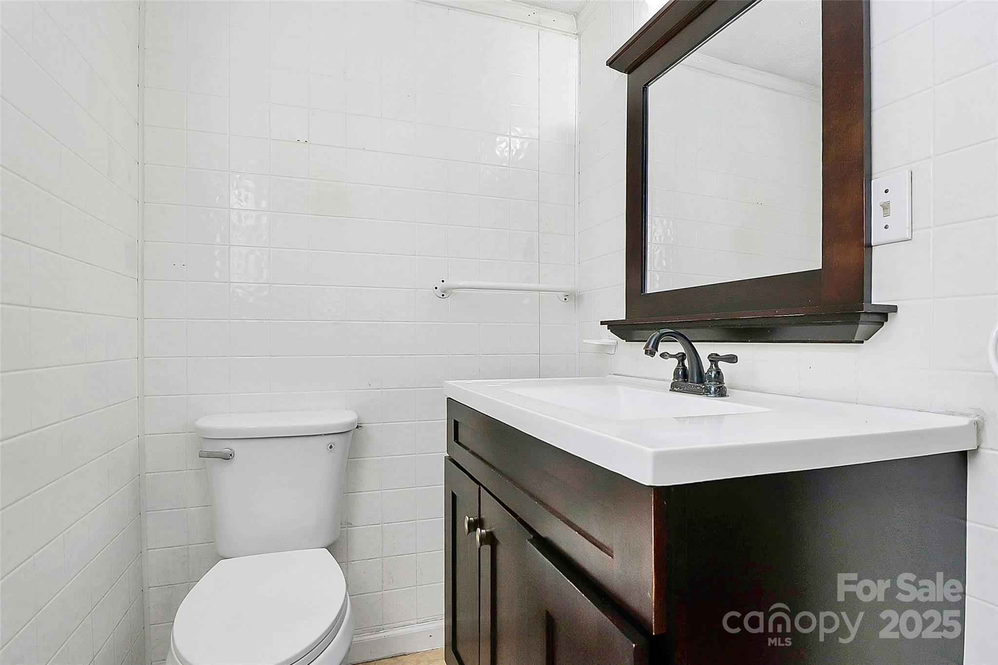 511 West Elliott Street Chester, SC 29706 - Photo 25 of 32 a bathroom with a sink toilet and mirror