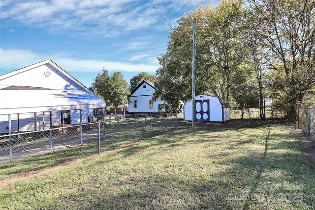 a view of a house with a yard covered with snow in the outdoor