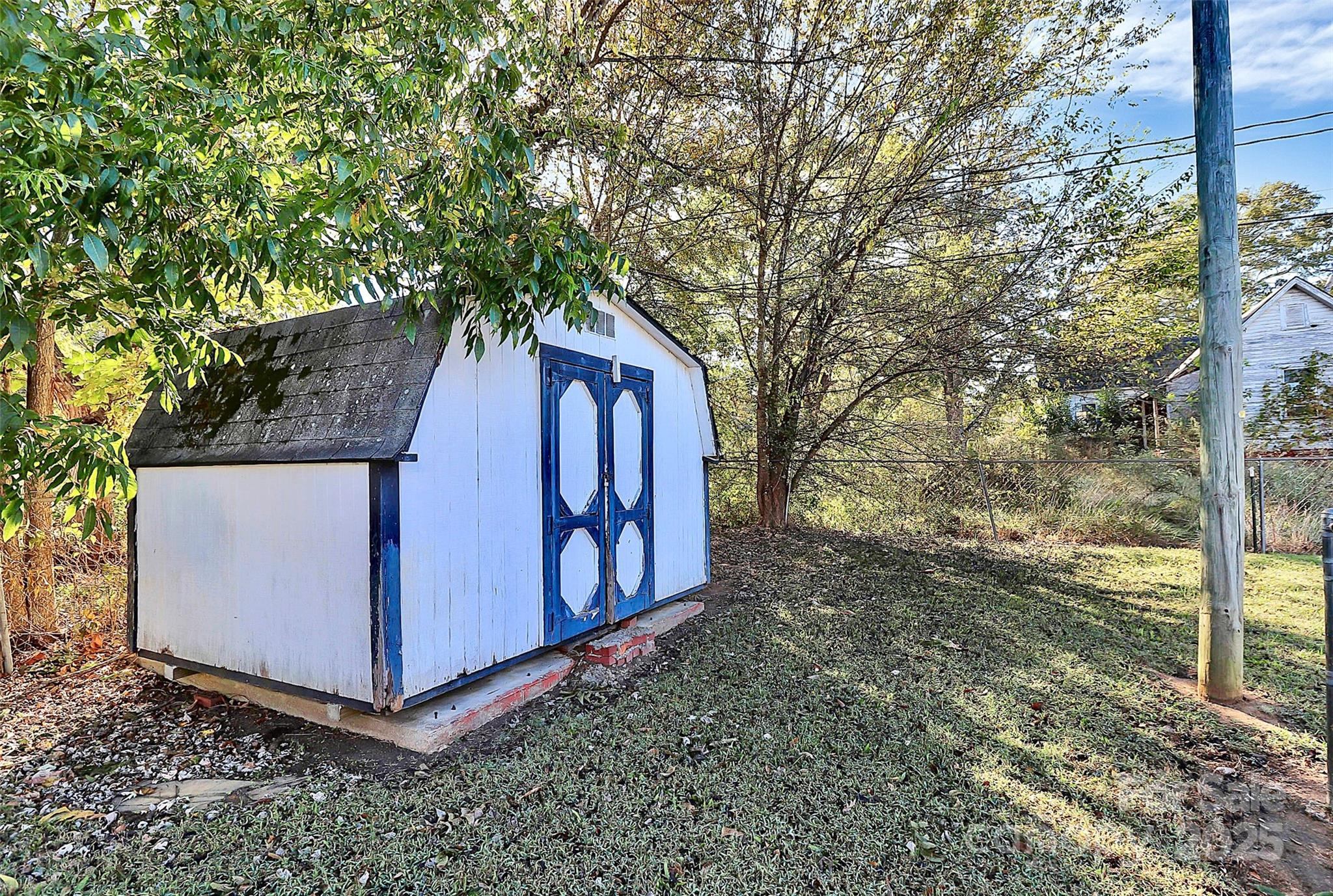 511 West Elliott Street Chester, SC 29706 - Photo 30 of 32 a view of a barn in the middle of a yard