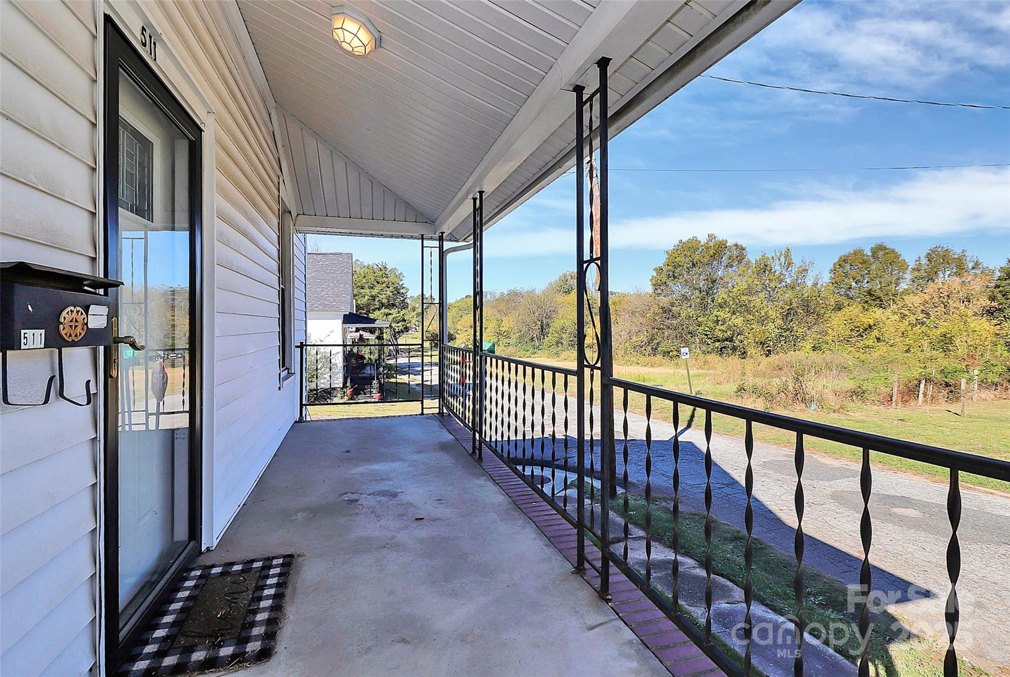 511 West Elliott Street Chester, SC 29706 - Photo 4 of 32 a view of a porch with wooden floor and outdoor space