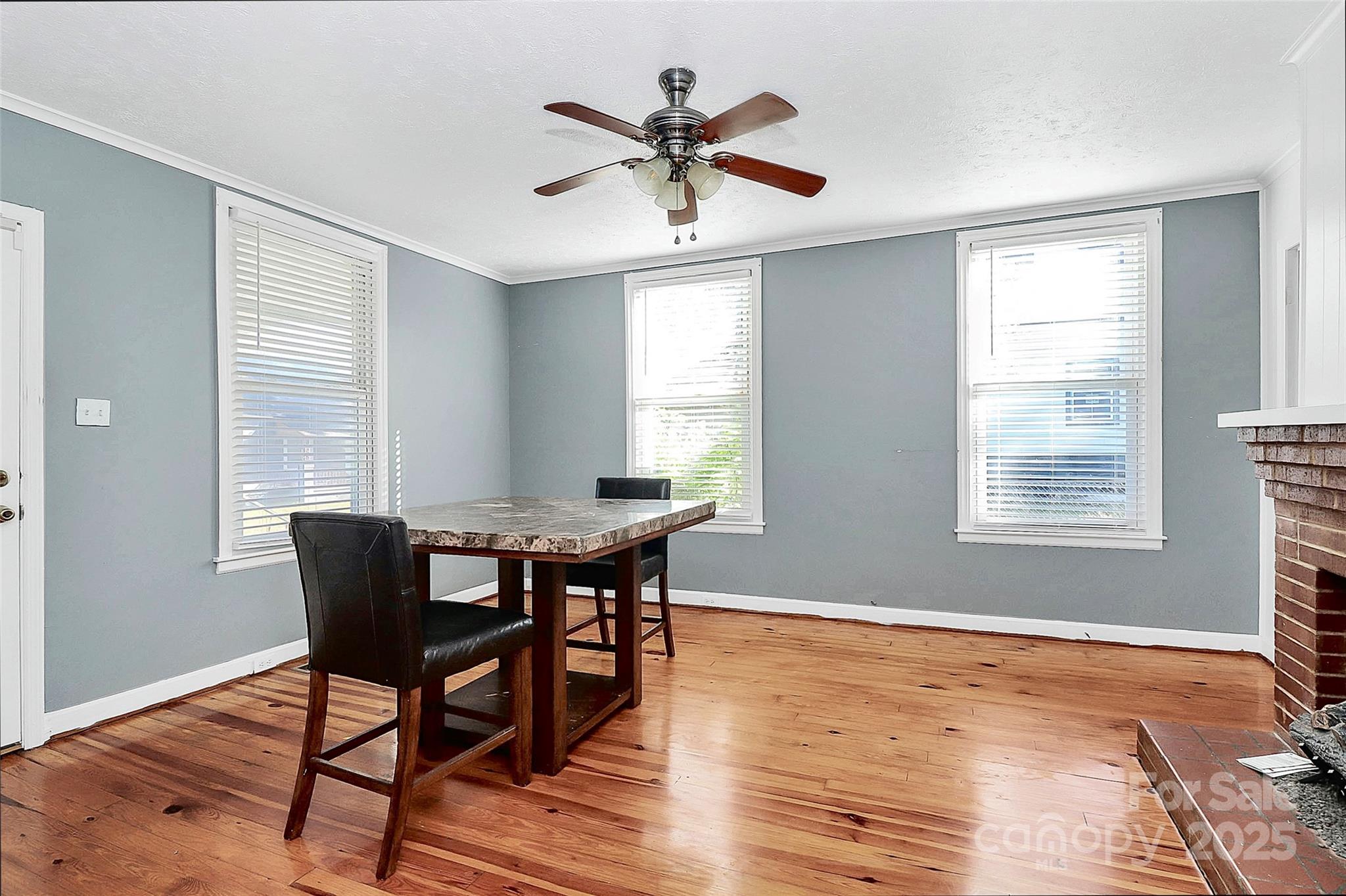 511 West Elliott Street Chester, SC 29706 - Photo 7 of 32 a dining room with wooden floor and a window