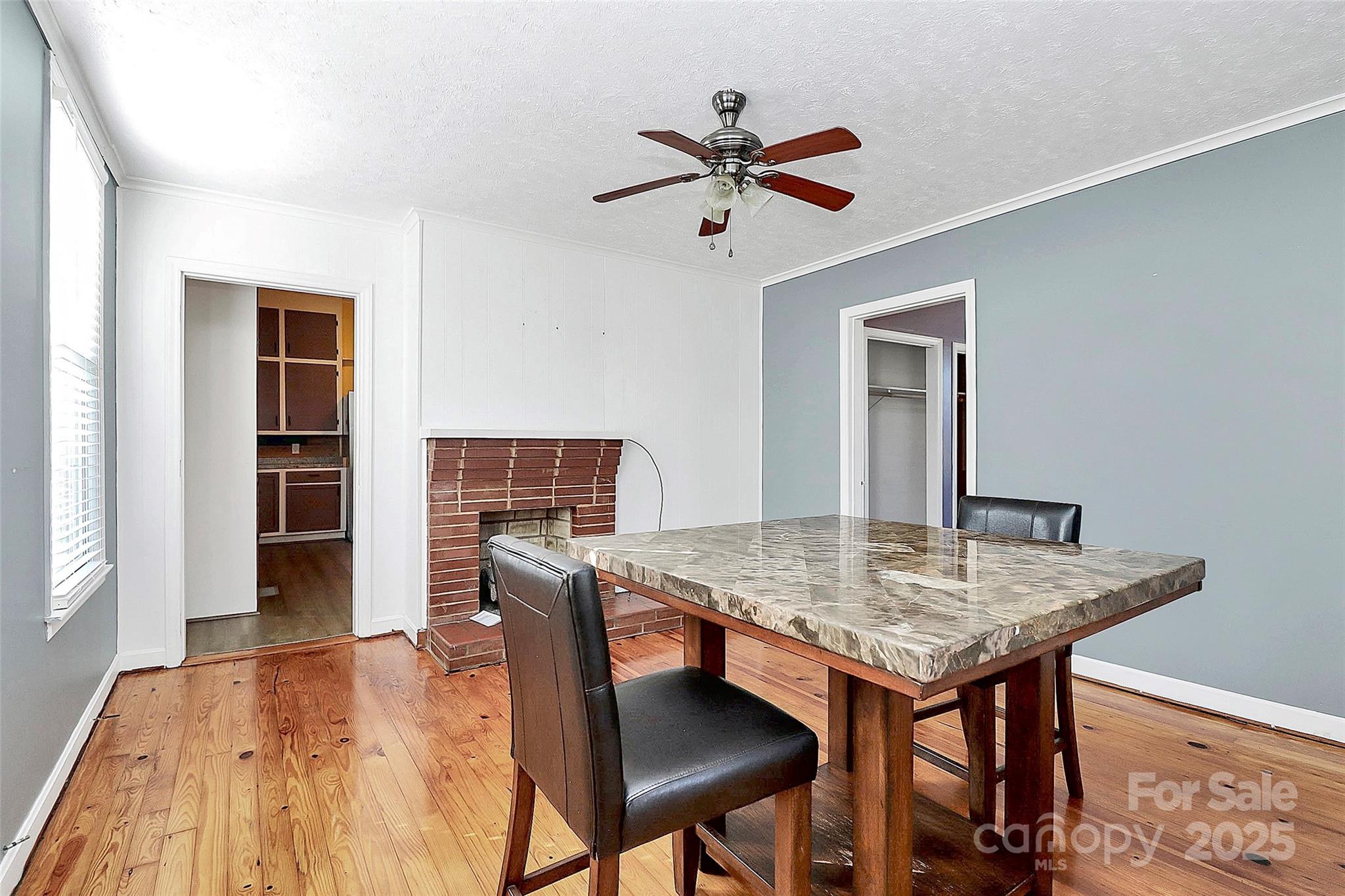 511 West Elliott Street Chester, SC 29706 - Photo 9 of 32 a view of a workspace space with furniture and wooden floor