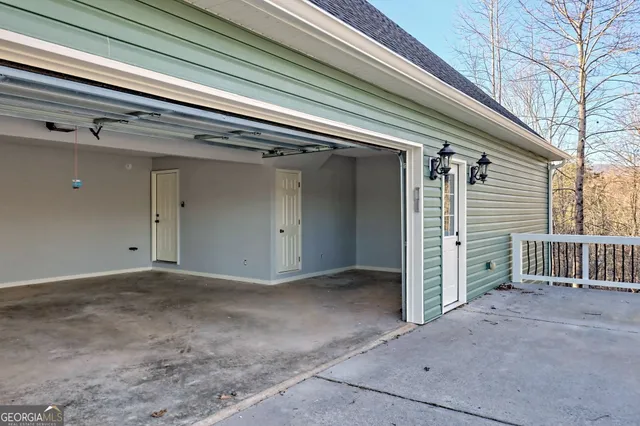 a view of roof deck with wooden floor and fence