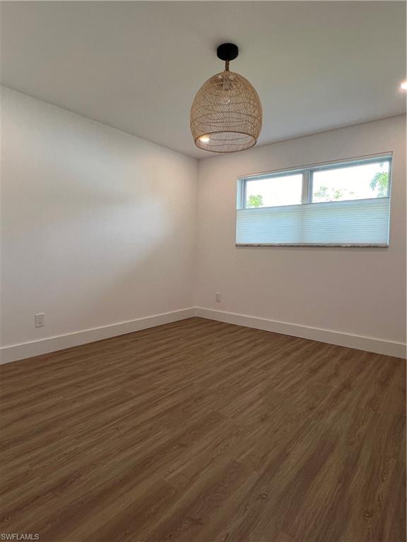 1793 Smugglers Cove, Unit B Naples, FL 34112 - Photo 14 of 23 a view of wooden floor and in window
