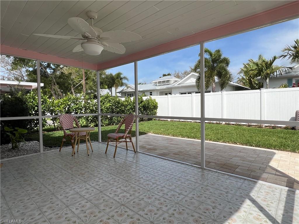 1793 Smugglers Cove, Unit B Naples, FL 34112 - Photo 22 of 23 a view of a patio with a table and chairs