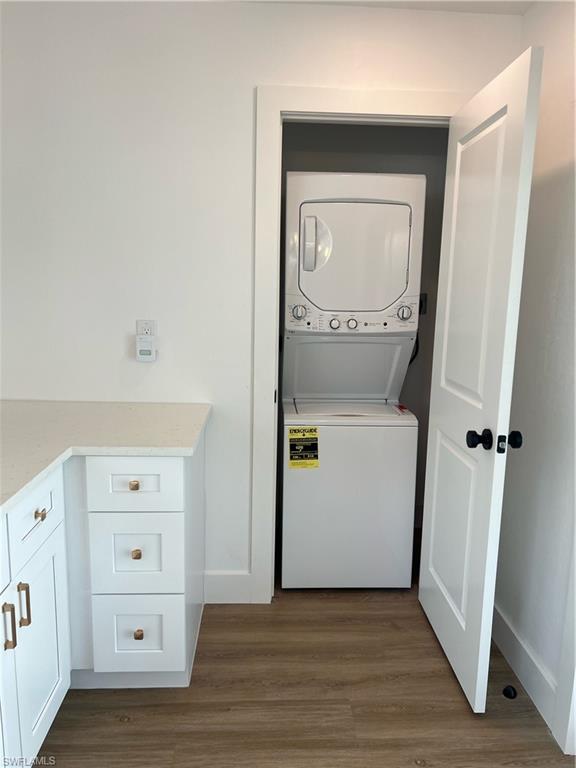 1793 Smugglers Cove, Unit B Naples, FL 34112 - Photo 10 of 23 a view of a hallway with wooden floor and closet