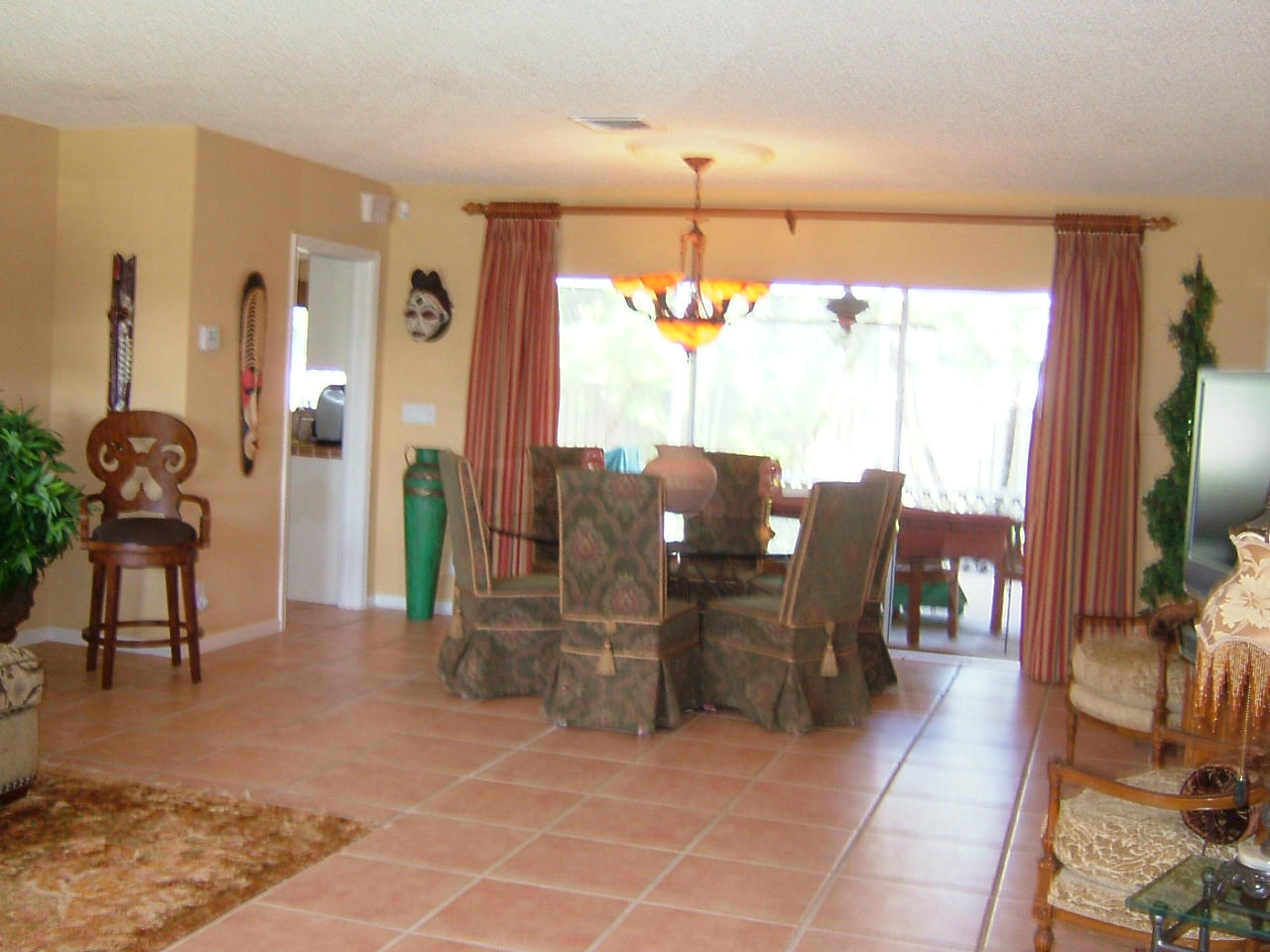 773 Apple Tree Lane Boca Raton, FL 33486 - Photo 6 of 25 a view of a dining room with furniture window and outside view