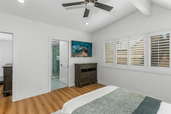 a bedroom with a bed and a fireplace